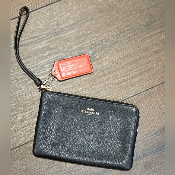Coach Handbags - Coach Black Wristlet with Added Coral Hang Tag